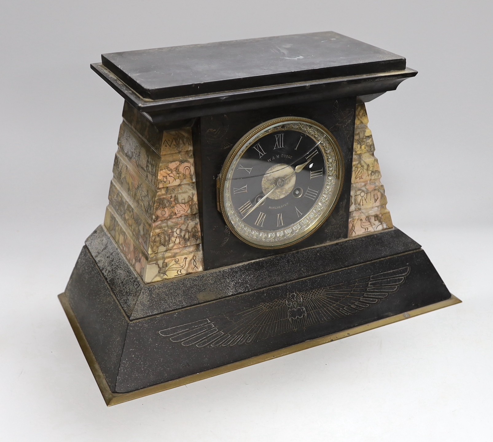 A W & M Dodge black slate and rose marble mantel clock with Egyptian engraved hieroglyphs, 25cm high